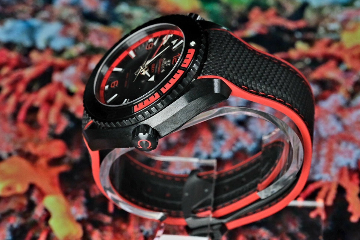 OMEGA Seamaster Planet Ocean 600M Deep Black GMT 215.92.46.22.01.003 — coiled view showing bezel