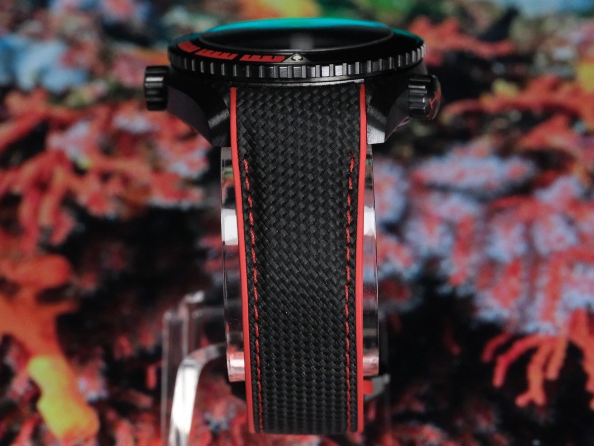 OMEGA Seamaster Planet Ocean 600M Deep Black GMT 215.92.46.22.01.003 — rubber strap macro detail