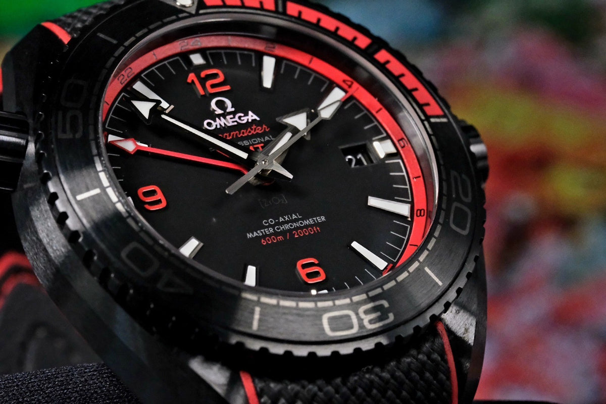 OMEGA Seamaster Planet Ocean 600M Deep Black GMT 215.92.46.22.01.003 — three-quarter view of dial