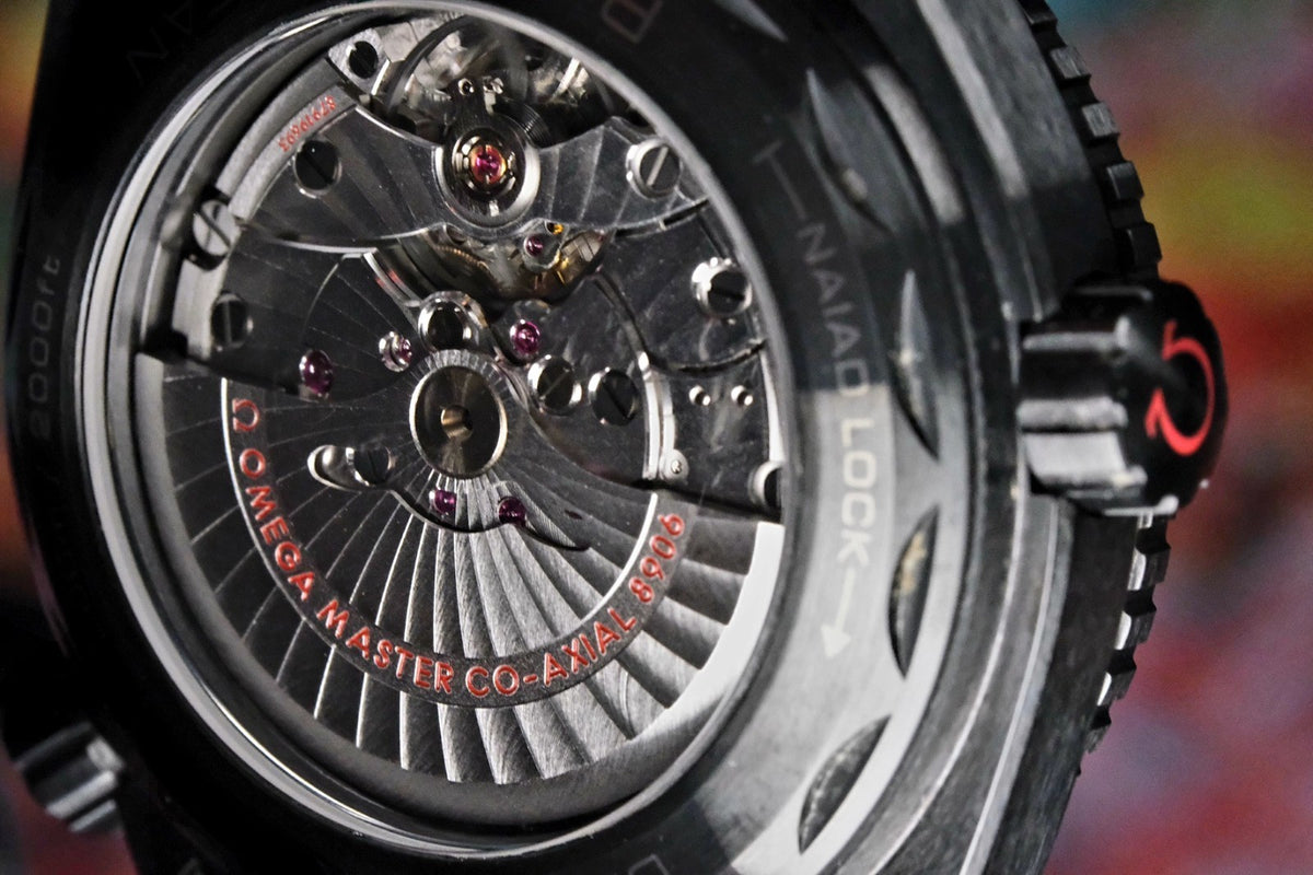 OMEGA Seamaster Planet Ocean 600M Deep Black GMT 215.92.46.22.01.003 — exhibition caseback and co-axial movement
